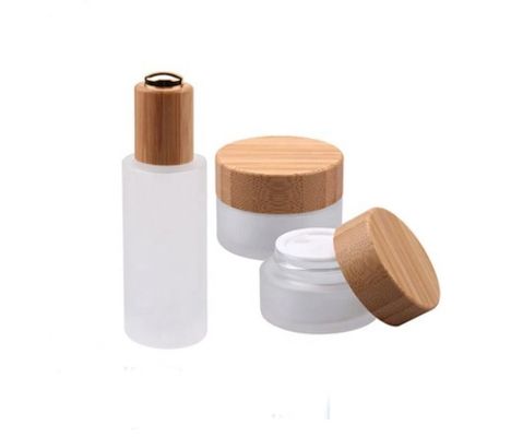 Il cosmetico vuoto rotondo di vetro stona l'imballaggio cosmetico di bambù naturale del contenitore