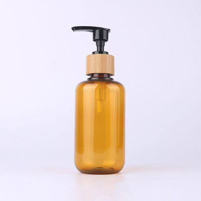 Amber Glass Bamboo Cosmetic Bottle con lo spruzzatore di legno della lozione dell'incisione del cappuccio