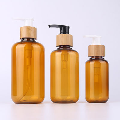 Amber Glass Bamboo Cosmetic Bottle con lo spruzzatore di legno della lozione dell'incisione del cappuccio