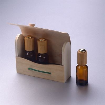 Bottiglia di olio essenziale di vetro con il contenitore di bambù di contagoccia resistente di bambù del bambino