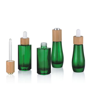 Bottiglia di olio essenziale di vetro con la piccola bottiglia di olio del contagoccia resistente di bambù del bambino