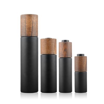 Nuovo cappuccio di bambù di legno sviluppato intorno a Violet Glass Bottle scura con la pompa della lozione