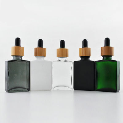 Bottiglia di vetro cosmetica del contagoccia 30ml di rettangolo con il cappuccio di bambù per olio essenziale