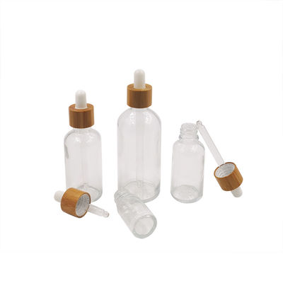 1oz svuotano le bottiglie del contagoccia di Amber Black Essential Oil Glass con i coperchi di bambù