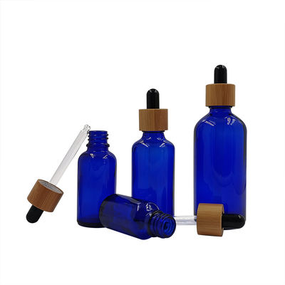 1oz svuotano le bottiglie del contagoccia di Amber Black Essential Oil Glass con i coperchi di bambù