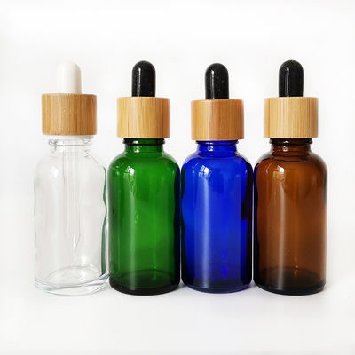 Bottiglia di olio essenziale di vetro con la piccola bottiglia di olio del contagoccia resistente di bambù del bambino