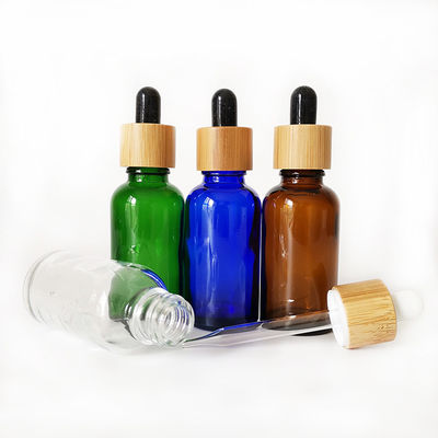 Bottiglia di olio essenziale di vetro con la piccola bottiglia di olio del contagoccia resistente di bambù del bambino